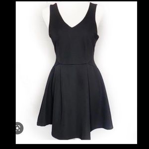 Black fit and flare skater mini dress. V neck line and V back.